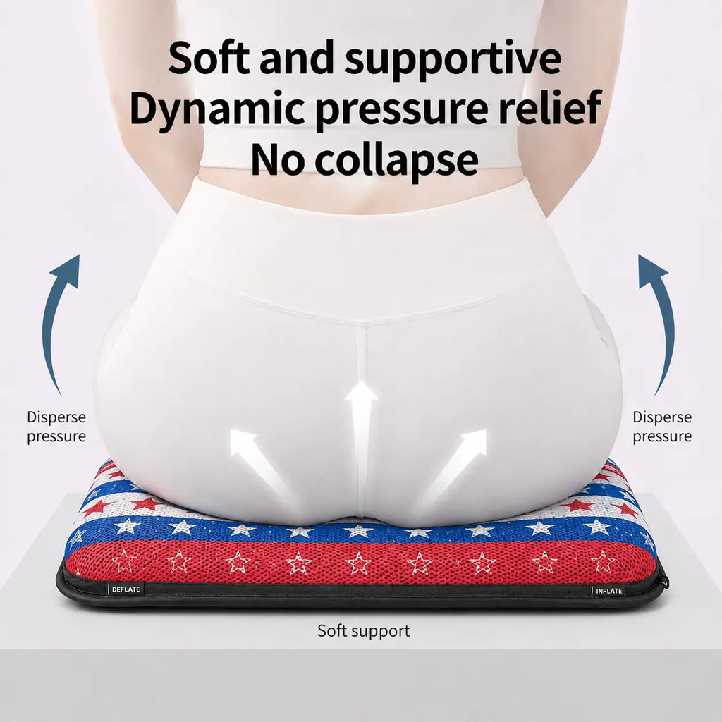 A promotional product infographic diagram demonstrating pelvic weight distribution on an ergonomic air seat cushion. Viewed from behind, a woman wearing white athletic wear sits on a patriotic American flag themed cushion featuring a structured "Wave Flag" mesh pattern with horizontal rows of white stars on a blue section, white stars on a red section, and red stars on a white section. Three white arrows point upward on her lower back to illustrate "Soft support," while blue curved arrows on both sides poin