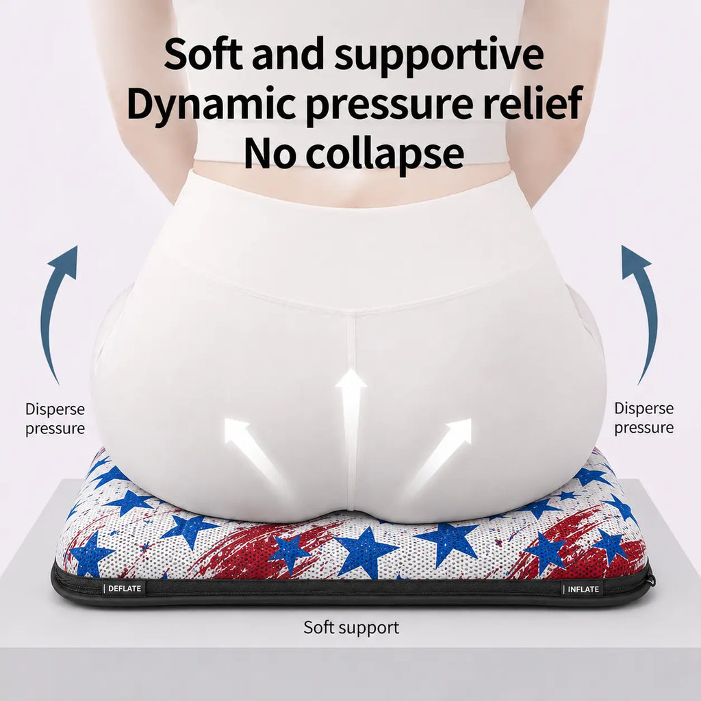 A promotional product infographic diagram demonstrating pelvic weight distribution on an ergonomic air seat cushion. Viewed from behind, a woman wearing white athletic wear sits on a classic patriotic American flag themed cushion featuring a bold arrangement of white stars over a solid blue section on the left and crisp red and white horizontal stripes on the right. Three white arrows point upward on her lower back to illustrate "Soft support," while blue curved arrows on both sides point outward, labeled "
